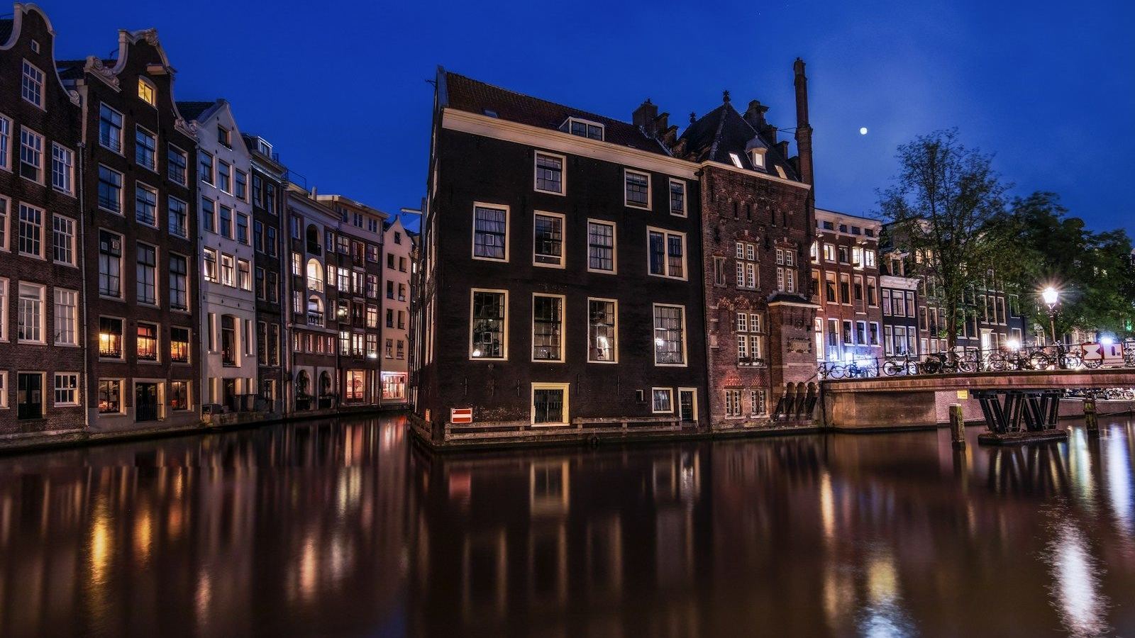 Canal houses beneath the evening sky